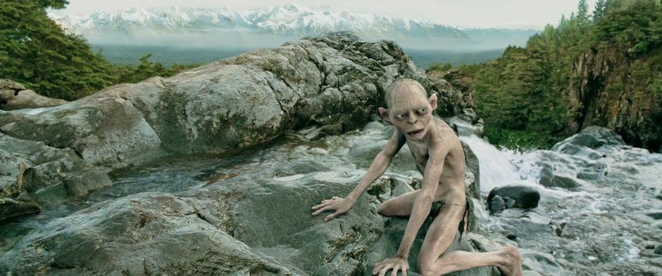 Gollum looks for fish in a mountain river.