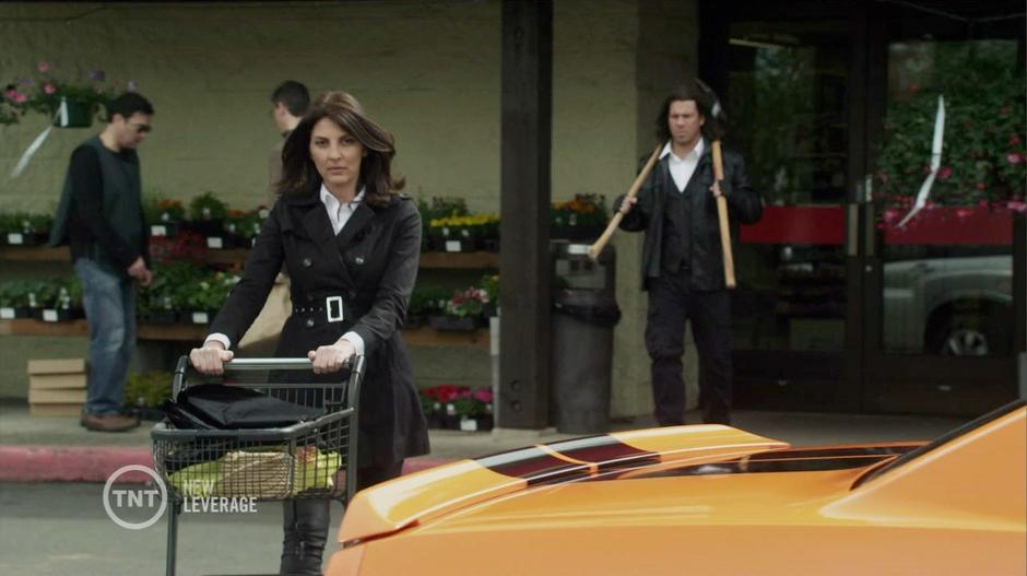 Sophie and Elliot walk out of the hardware store with suspicious supplies.