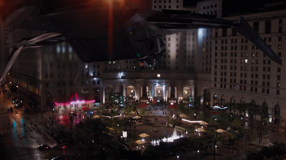 Black Widow hovers above the square in the S.H.I.E.L.D. aircraft.