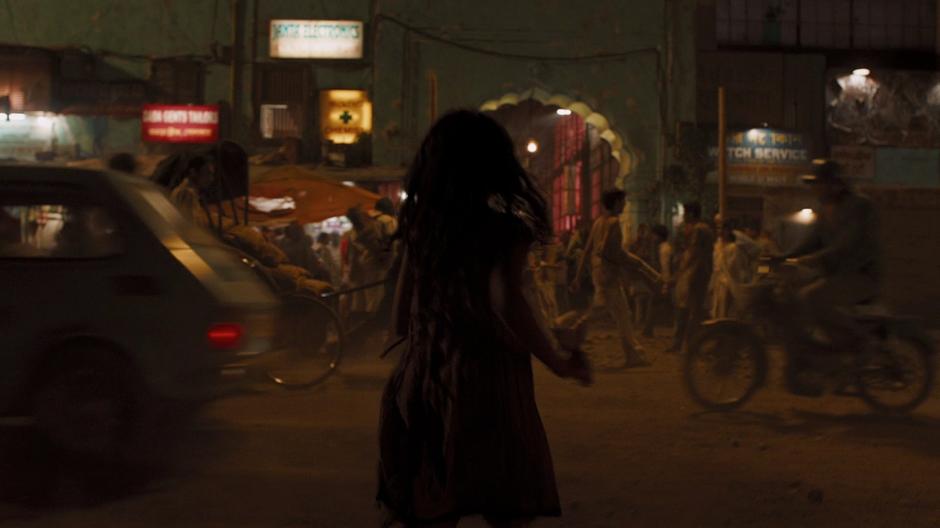 A young girl runs through the streets on her way to Bruce Banner's place.