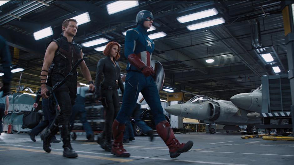 The Avengers team walks through the carrier deck on their way to save New York.