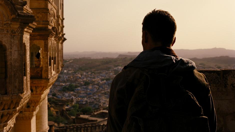 Ra's Al Ghul looks over at the princess who he eventually has an affair with.