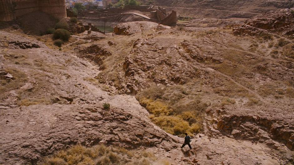 Bruce walks across the landscape after escaping The Pit.
