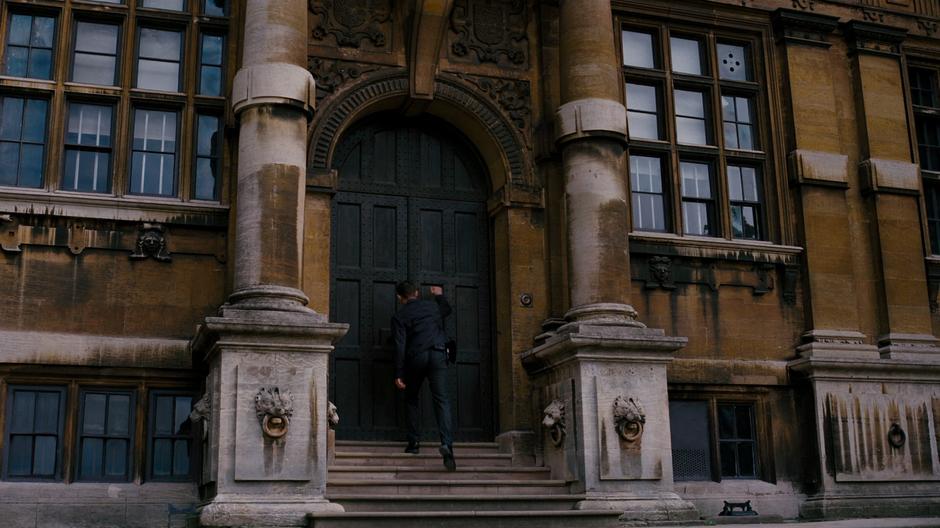 Blake knocks on the front door of the manor.