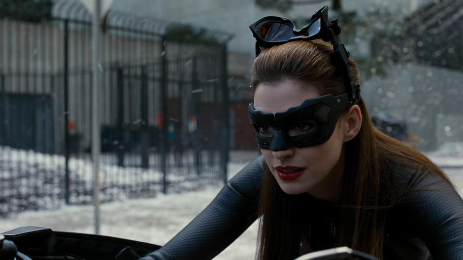 Selina gives a satisfied look at the destroyed barricade.