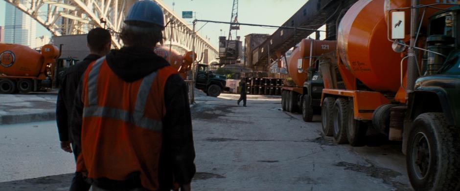 Blake approaches the cement workers to question them about the construction.