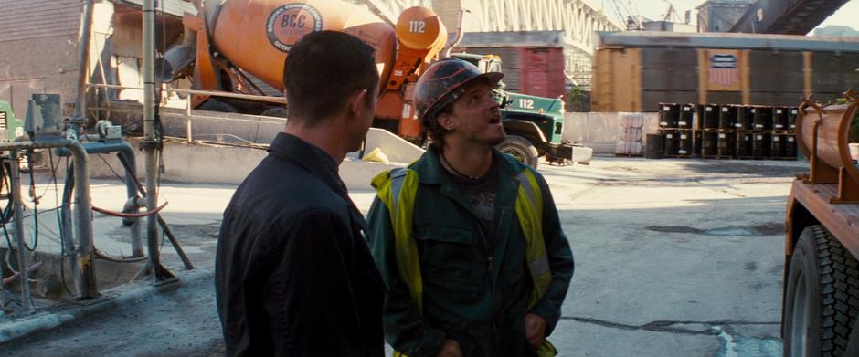 Blake talks to the foreman about their construction projects.