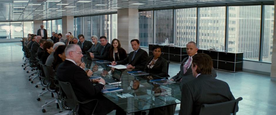 Bruce tells the Wayne Enterprises board about handing the company over to Miranda.