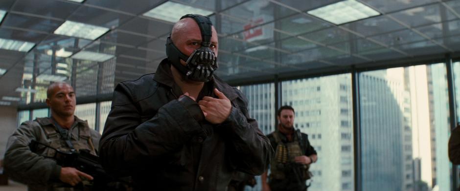 Bane and his thugs come into the boardroom to take some board members to retrieve the bomb.