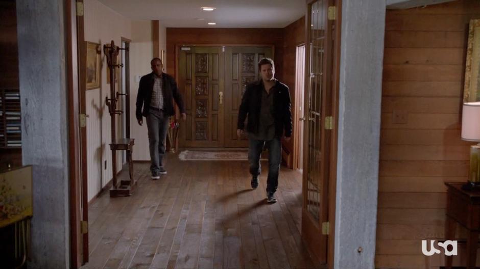 Shawn and Gus search through the house.