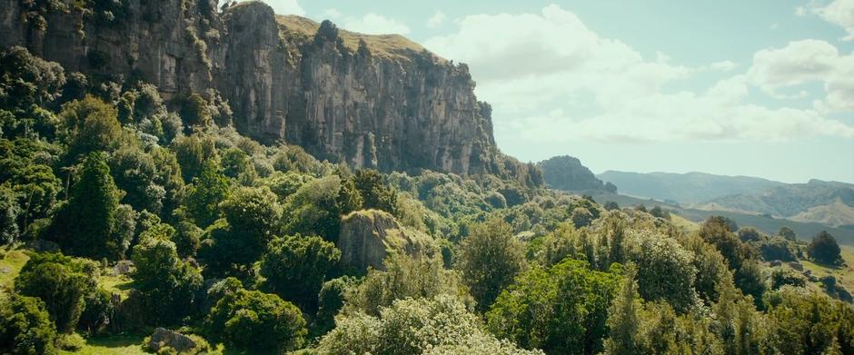 Establishing shot of the cliffs and the forest below.