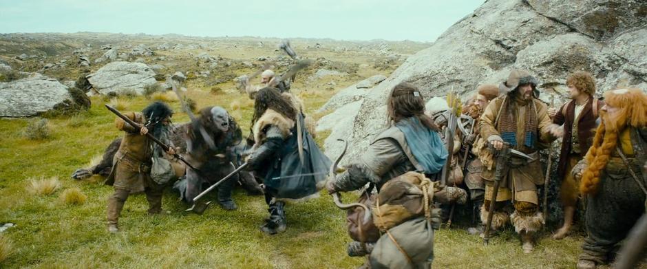 The dwarves fight off one of the warg riders.
