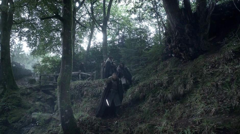 Ned Stark leads his son off the path.