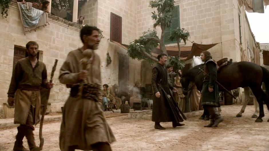 Littlefinger leads Ned Stark to his brothel.