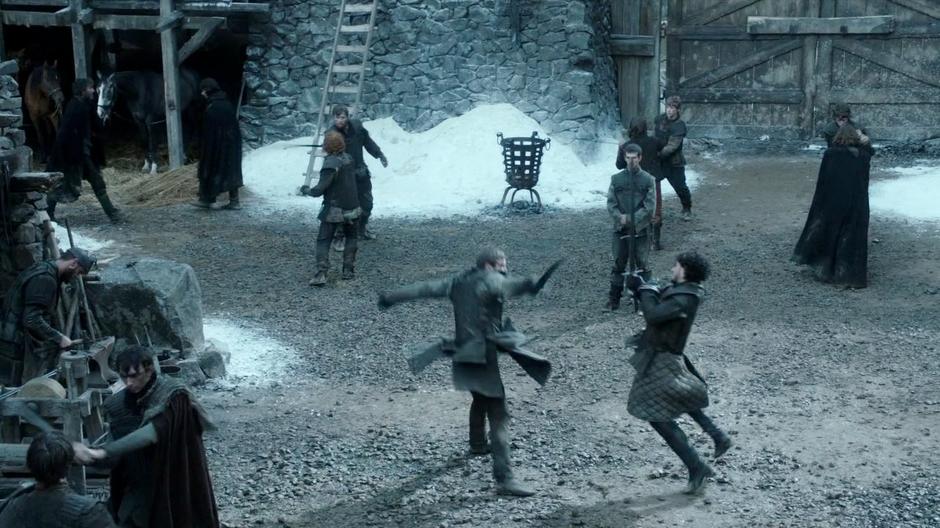 Jon Snow spars with another trainee.