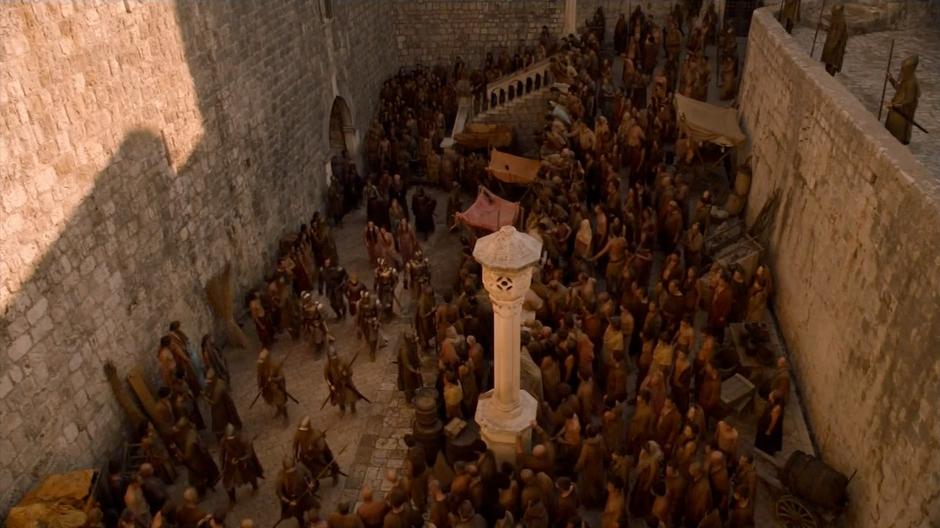 The Lannister group attempts to move through an angry crowd.
