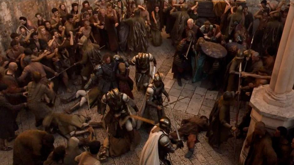 The Hound defends Joffrey from the angry mob surrounding them.