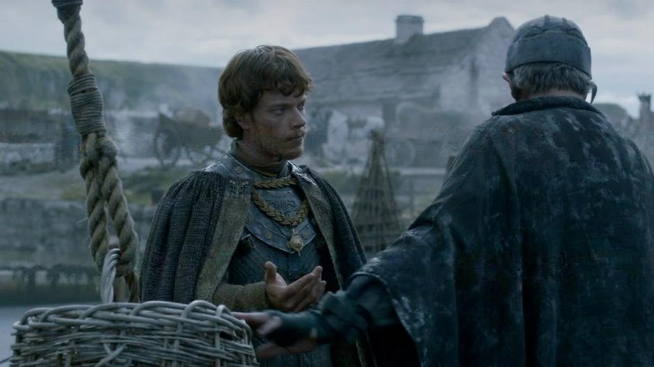 Theon talks to one of the dock workers.