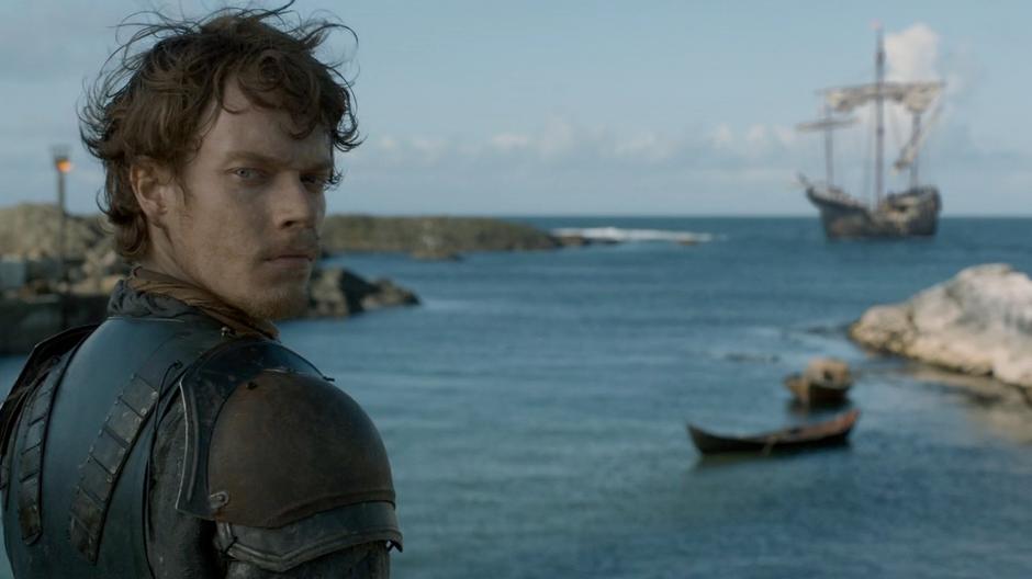 Theon looks back at his crew after seeing the ship in the bay.