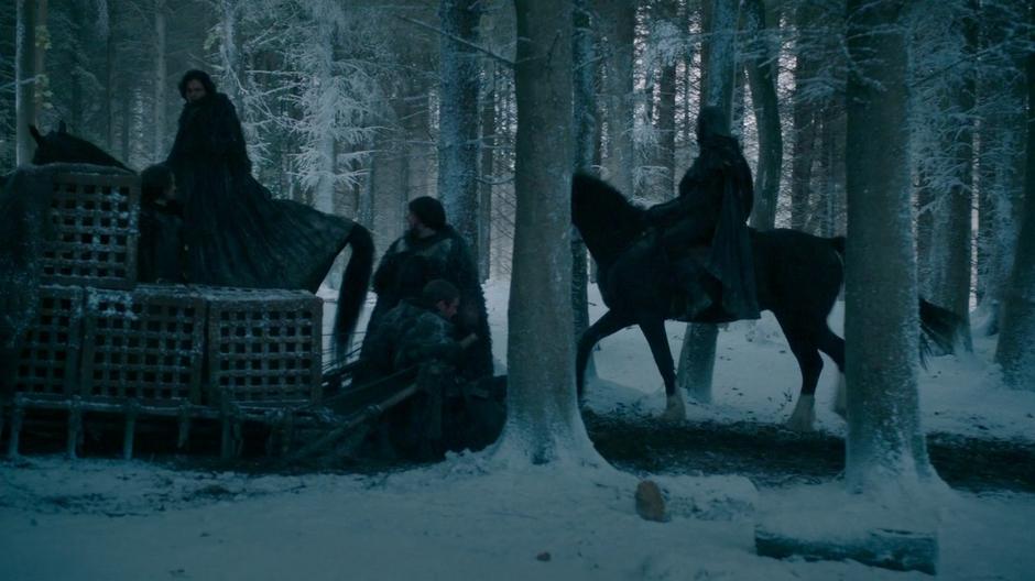 Jon Snow rides into the camp around the keep.