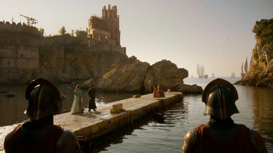 Littlefinger walks down the pier to where Sansa and Shae are talking.
