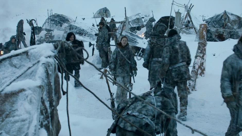 Ygritte leads Jon Snow through the Wildling camp.