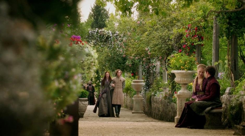 Lancel escorts Sansa through the gardens.