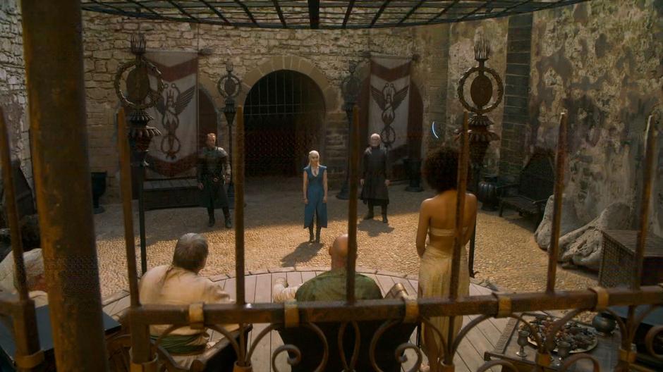 Daenerys, Ser Jorah, and Barristan Selmy enter to talk to the Good Masters about the Unsullied.