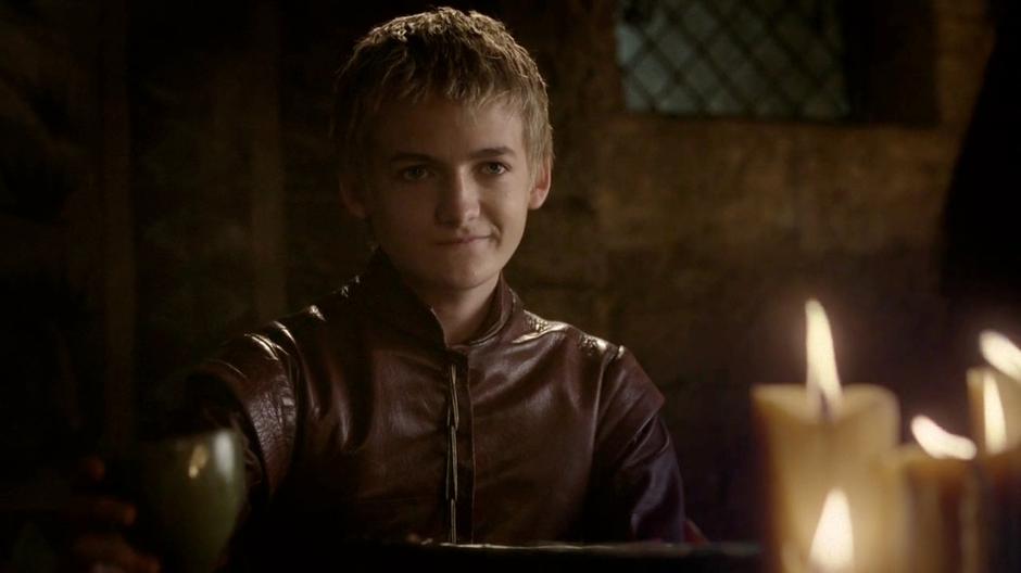 Joffrey gets a creepy smirk on his face while talking with Sansa.