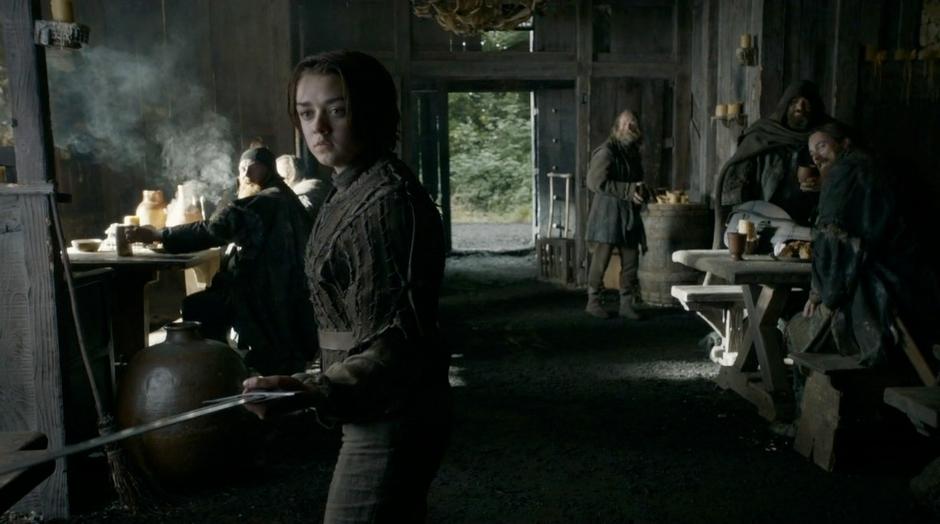 Arya points her sword at Thoros of Myr after questioning whether they were allowed to leave.