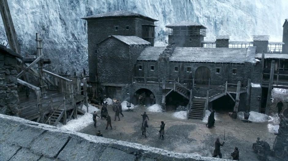 Wide establishing shot of the castle as the new Night's Watch trainees practice their swordplay.