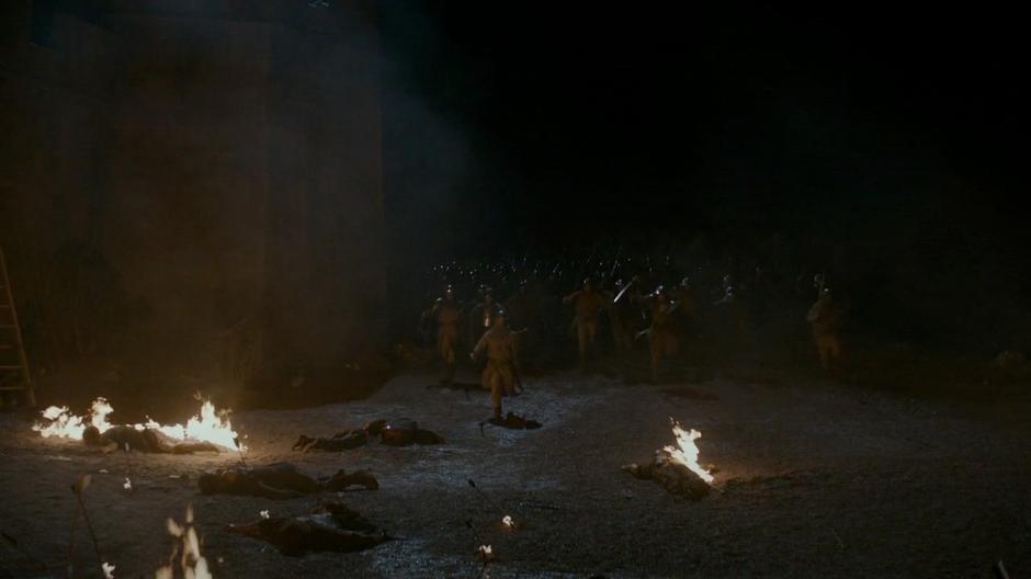 The Goldcloaks led by Tyrion flank the attacking army at the base of the wall.