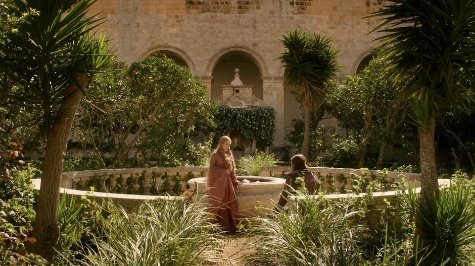 Cersei walks up to Ned who is resting in the garden.