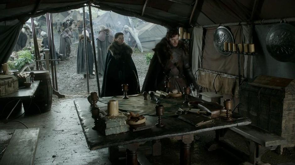Catelyn approaches Robb in his command tent.