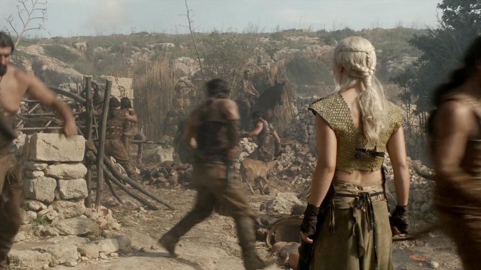 Daenerys sees what the Dothraki riders are doing to the villagers.