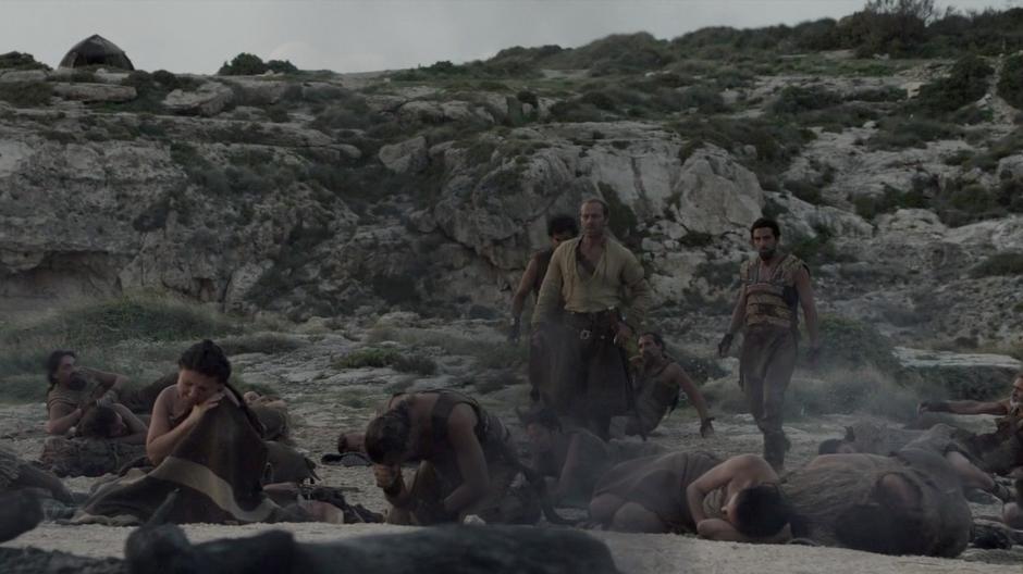 Ser Jorah walks across the campsite the morning after Daenerys entered the bonfire.