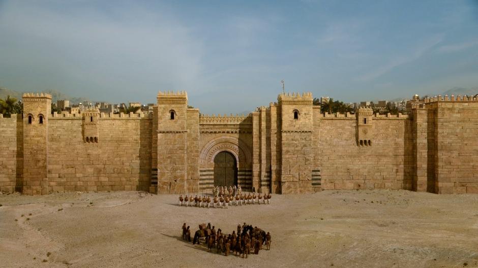The Dothraki wait outside the gate as the Thirteen come out to meet them.