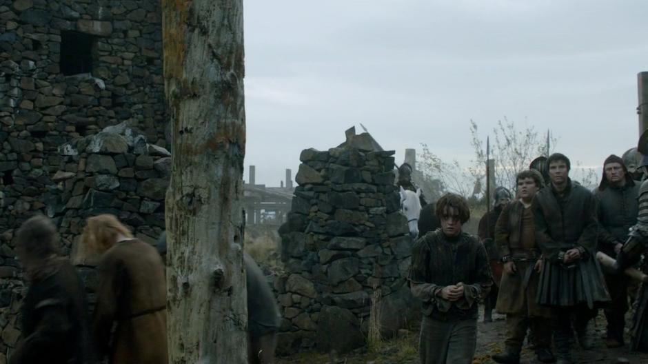 Arya, Gendry, and Hot Pie are led into the castle.