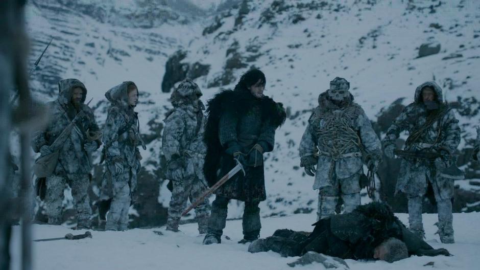 The Wildlings watch as Jon Snow slays the Halfhand.