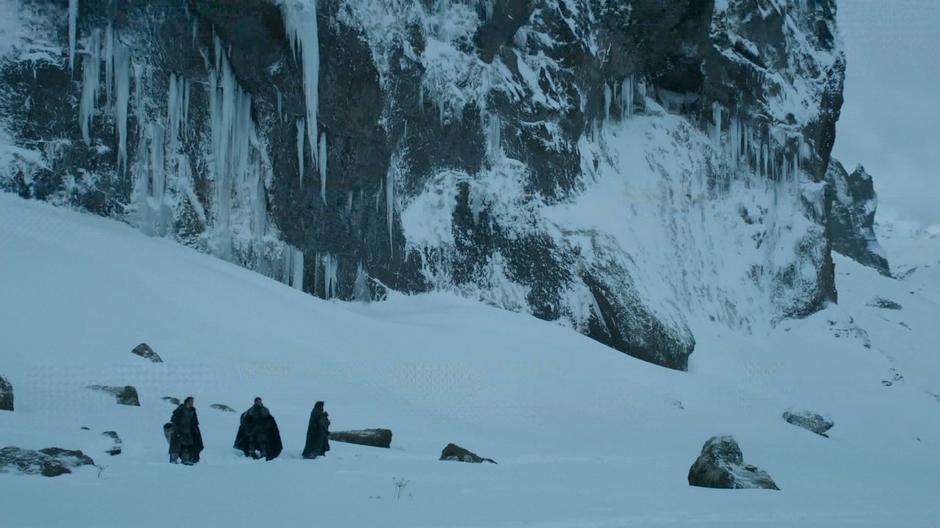 Sam and two other Night's Watch members stand at the base of the Fist of the First Men when they hear the third horn. The cliff face behind them was added digitally.