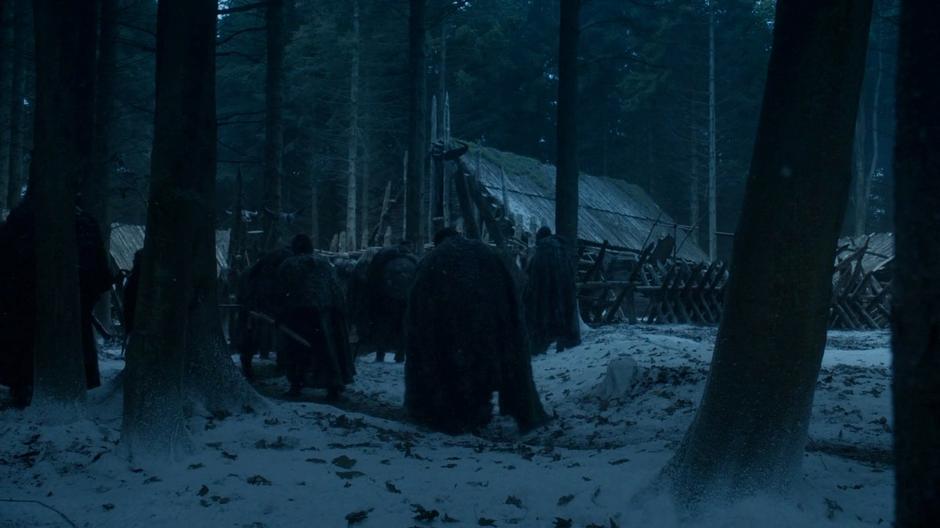 The remaining members of the Night's Watch expedition trudge up to the cabin.