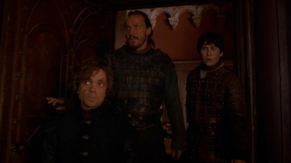 Tyrion and Bronn lead Pod into one of the rooms in the brothel for his gift.