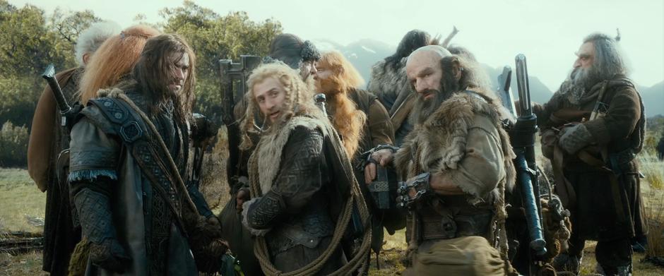 The dwarves look over at Gandalf when he reports that he isn't coming with them.