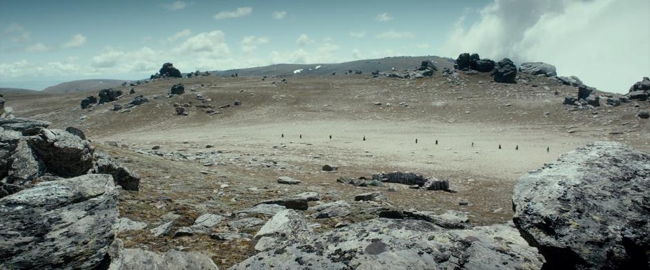 Bilbo and the dwarves walk through a desolate landscape on their way to the mountain.