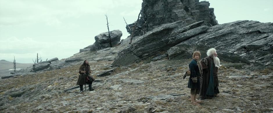 Thorin walks up to Bilbo and Balin.