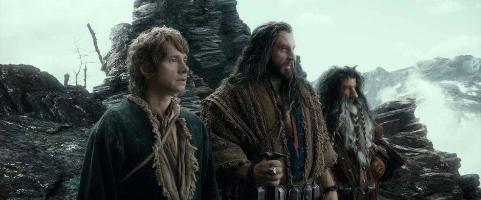 Bilbo, Thorin, and Bifur look out over the ruins of Dale.