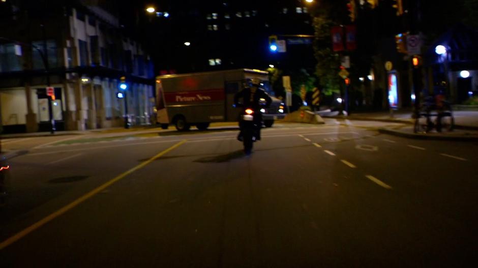 Another gang member has to turn around when their route is blocked by a news van.