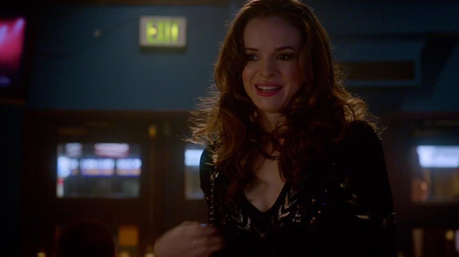 Caitlin enters the bar in a fancy outfit.