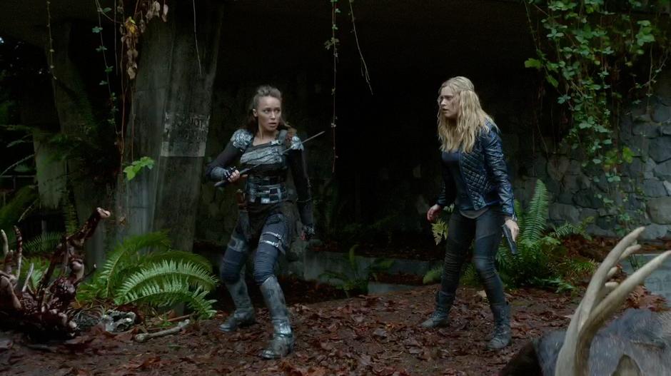 Lexa and Clarke prepare to defend against the creature.