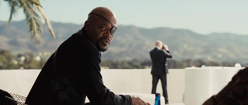 Nick Fury talks to Tony Stark on the deck of Stark mansion.